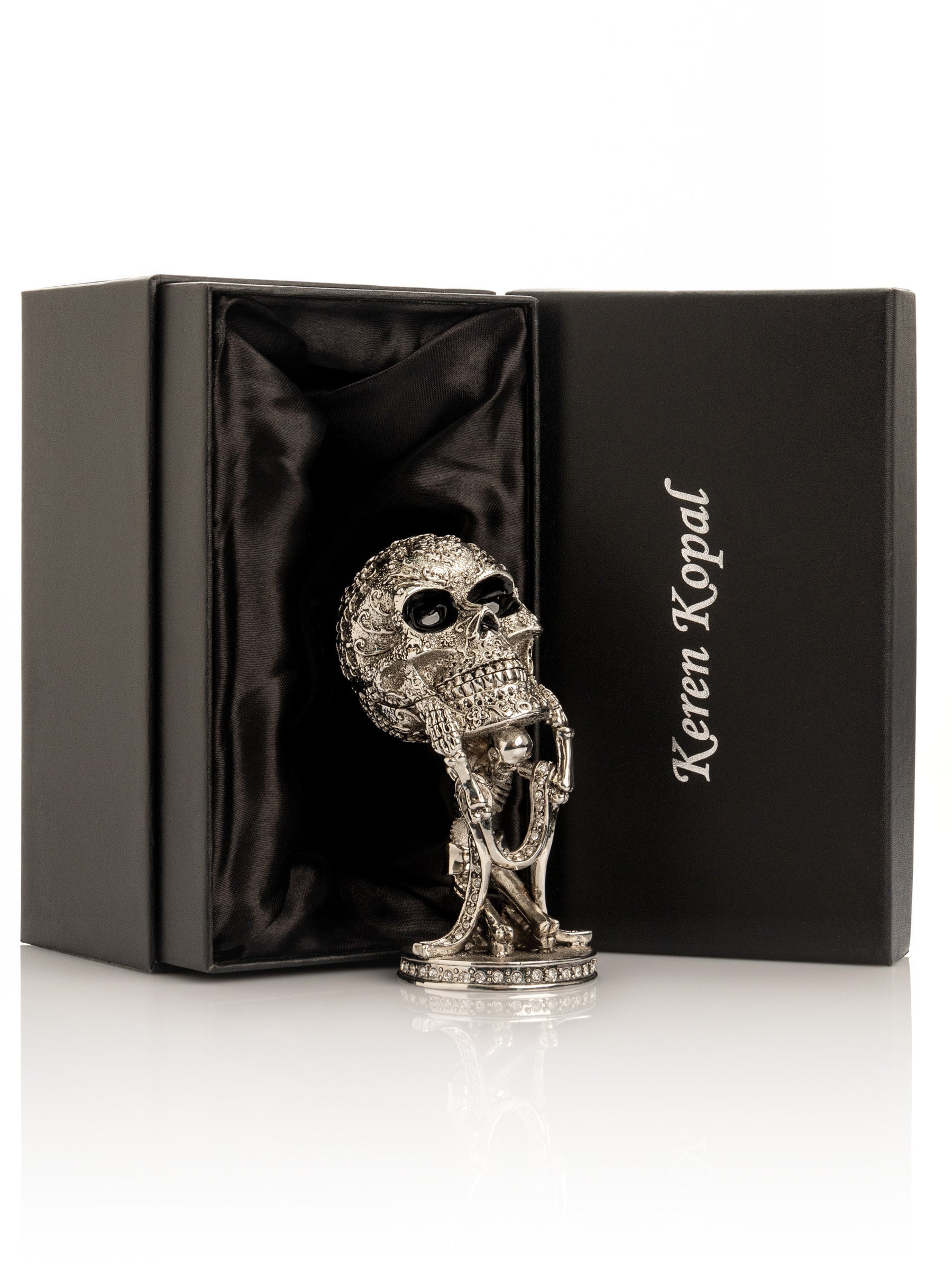 Silver Skeleton holding Skull