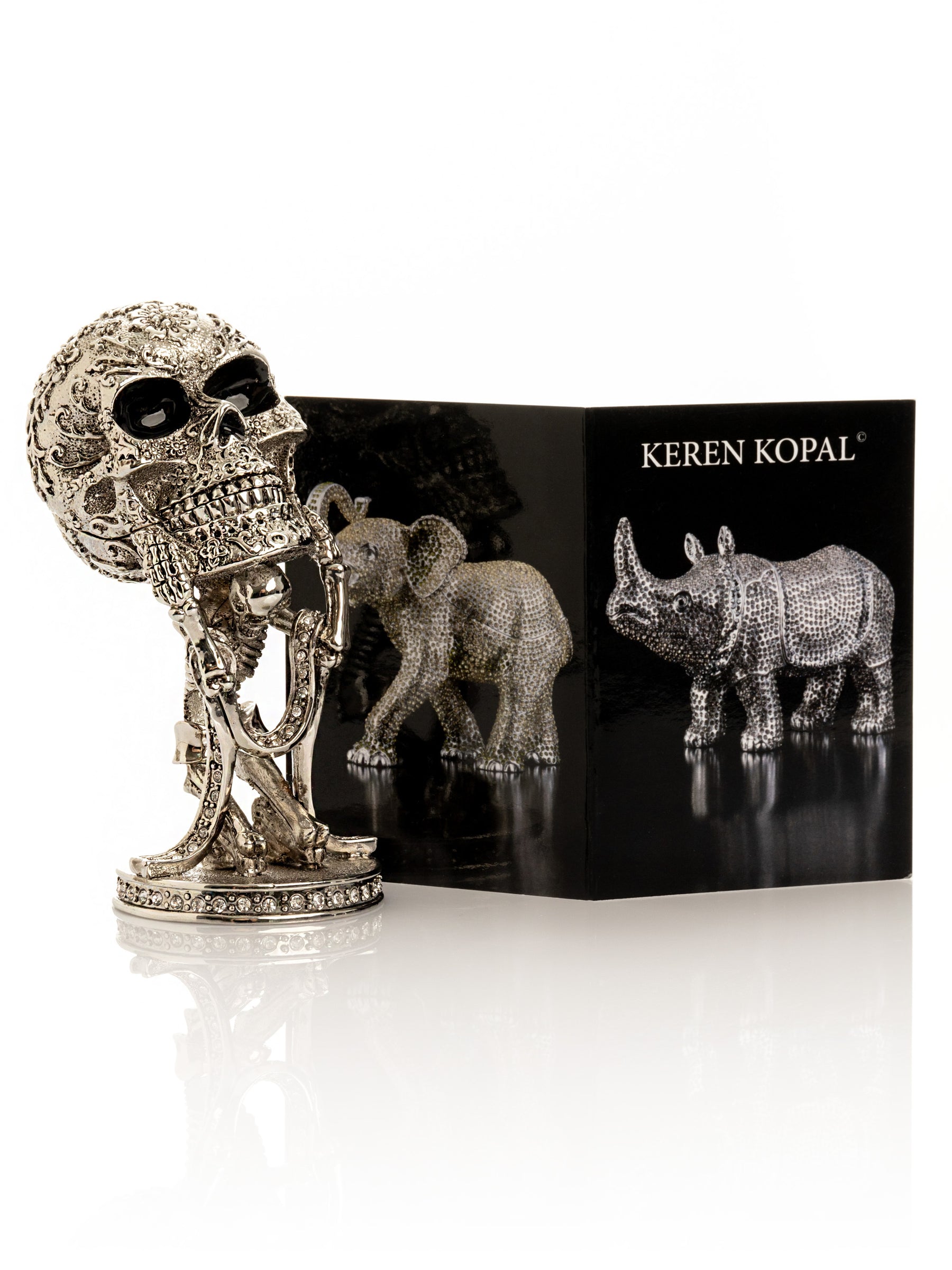 Silver Skeleton holding Skull