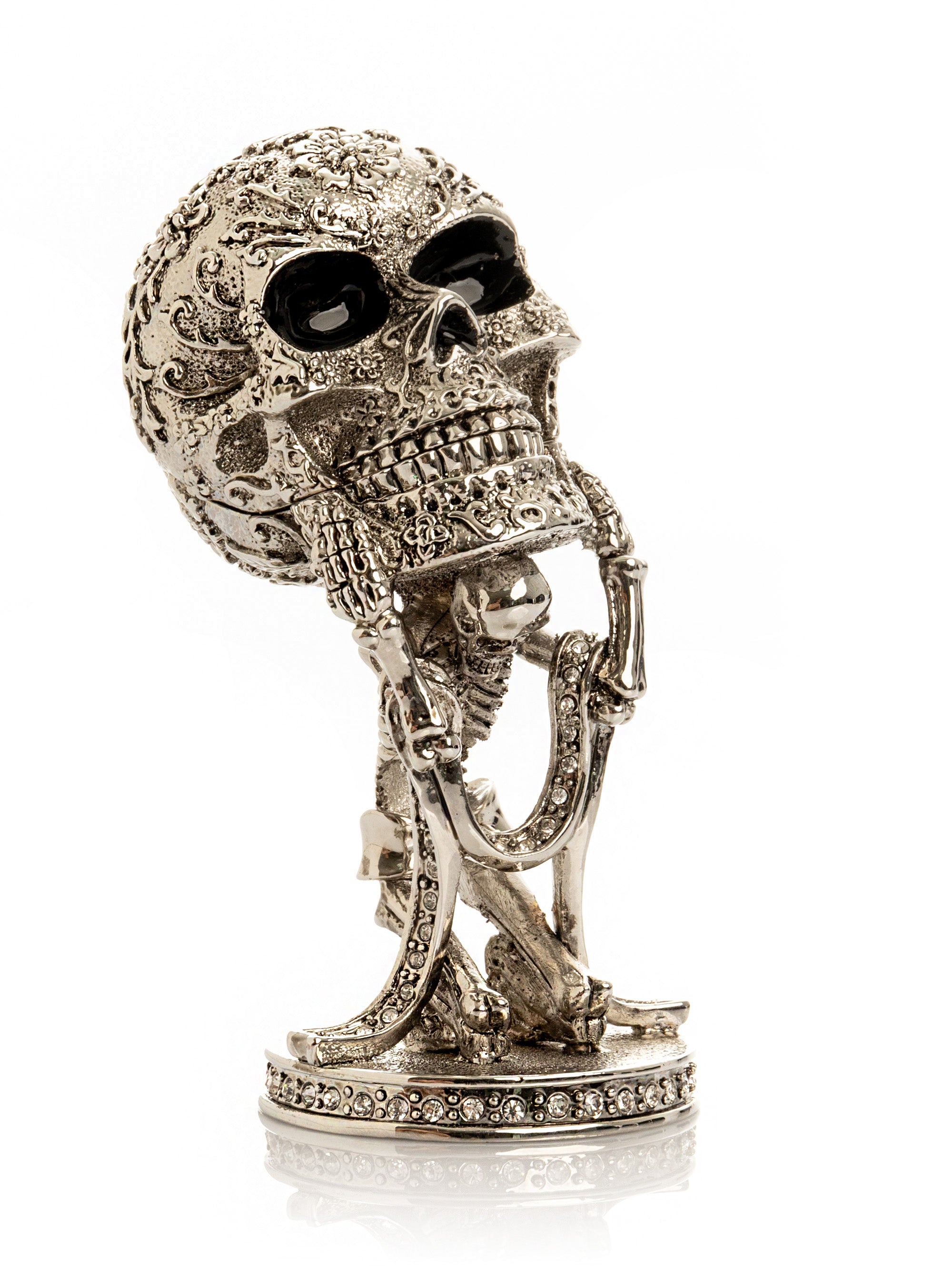 Silver Skeleton holding Skull