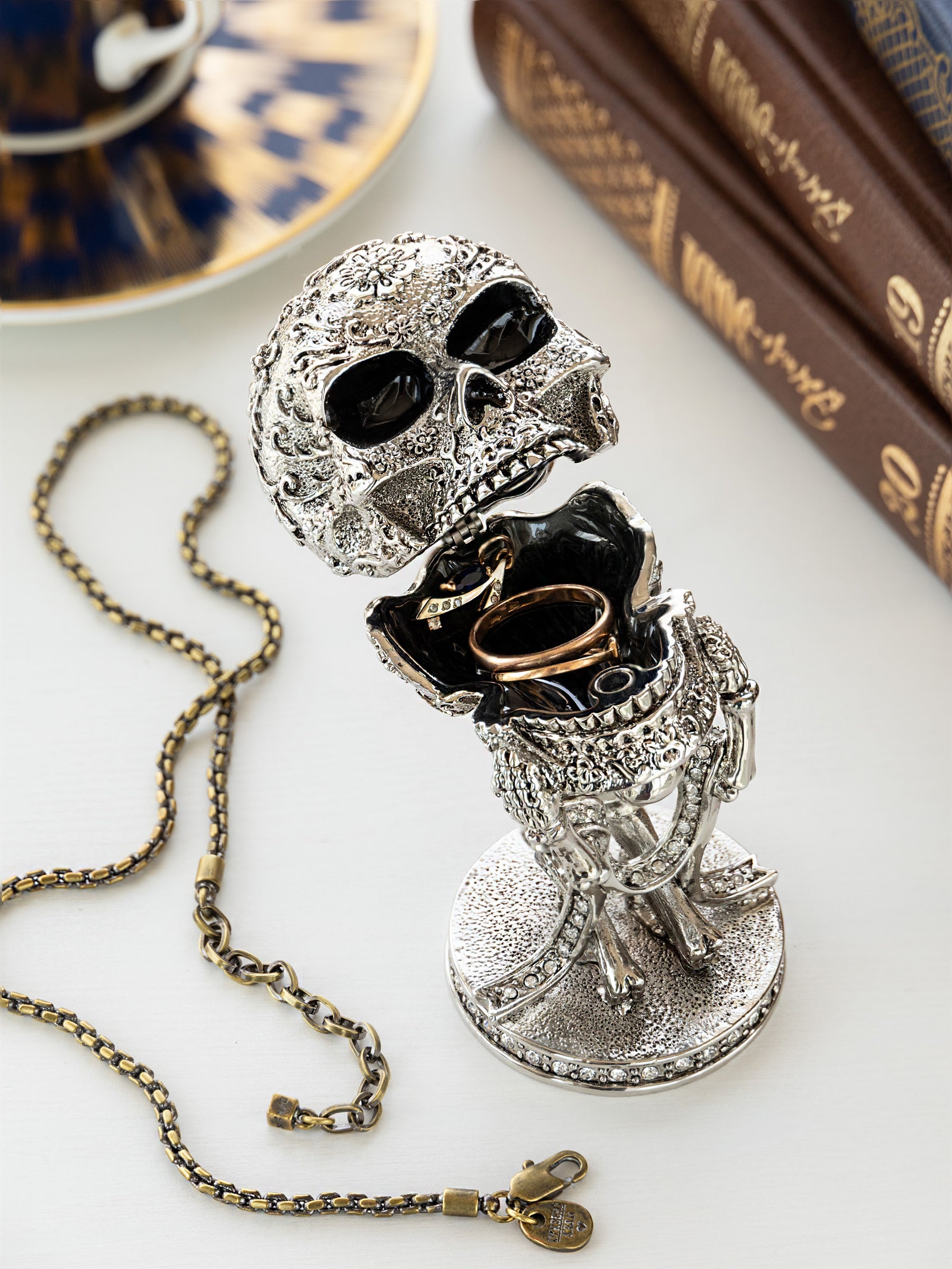 Silver Skeleton holding Skull