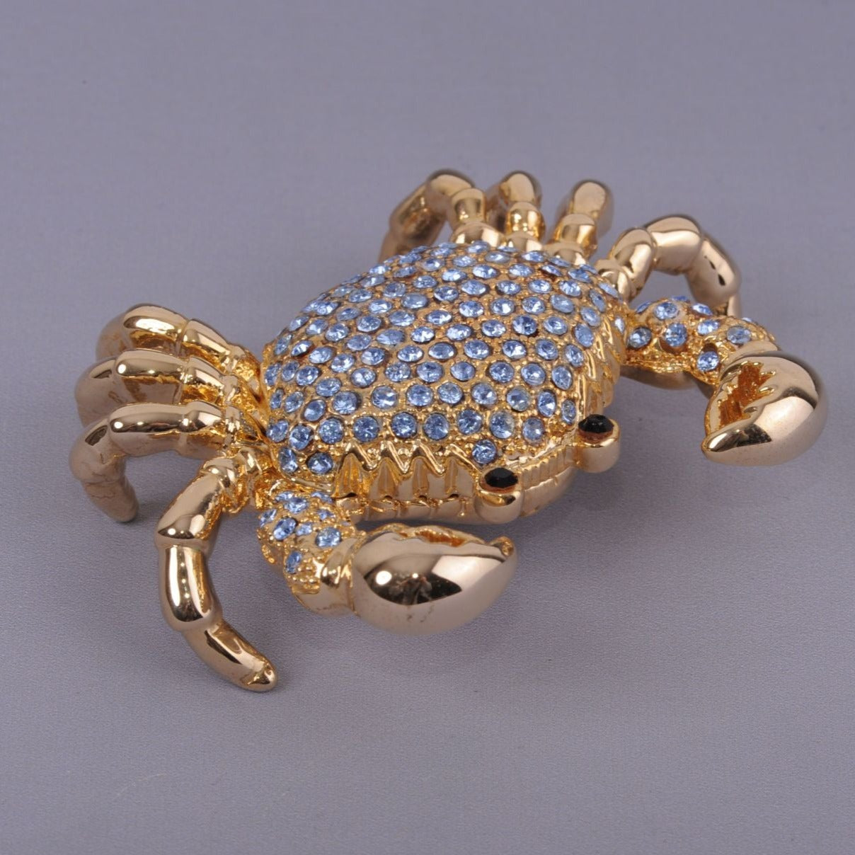 Golden Crab with blue stones