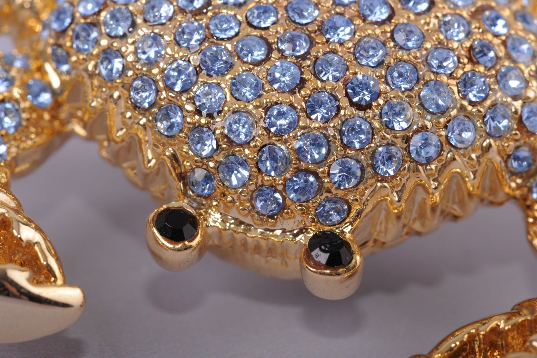 Golden Crab with blue stones