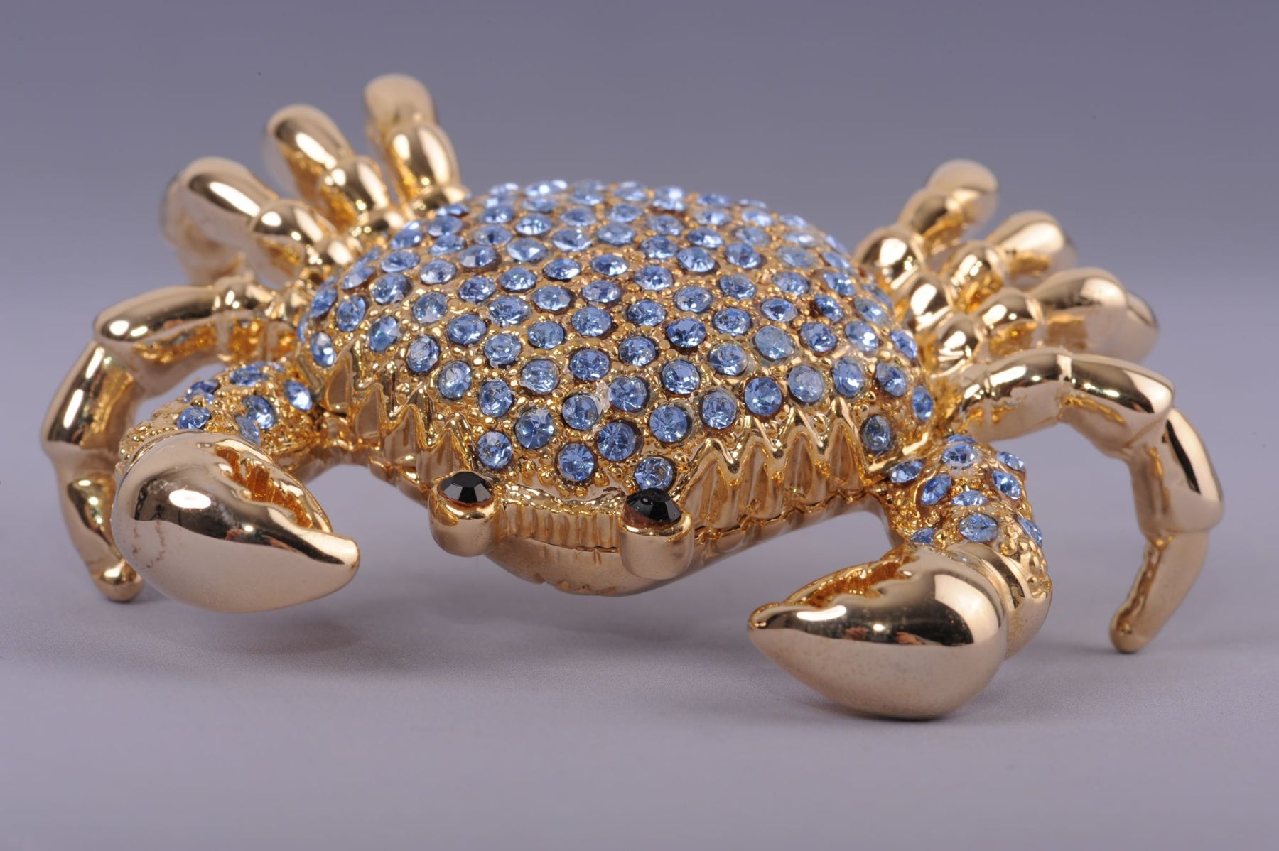 Golden Crab with blue stones