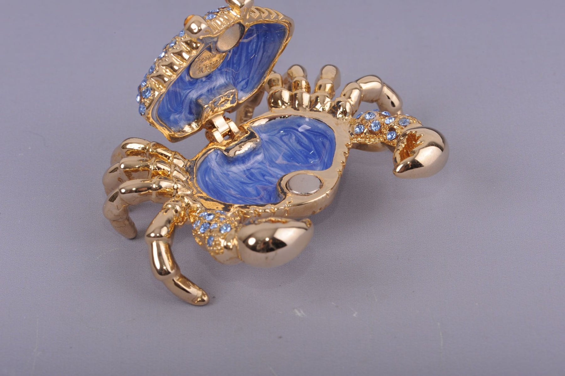 Golden Crab with blue stones