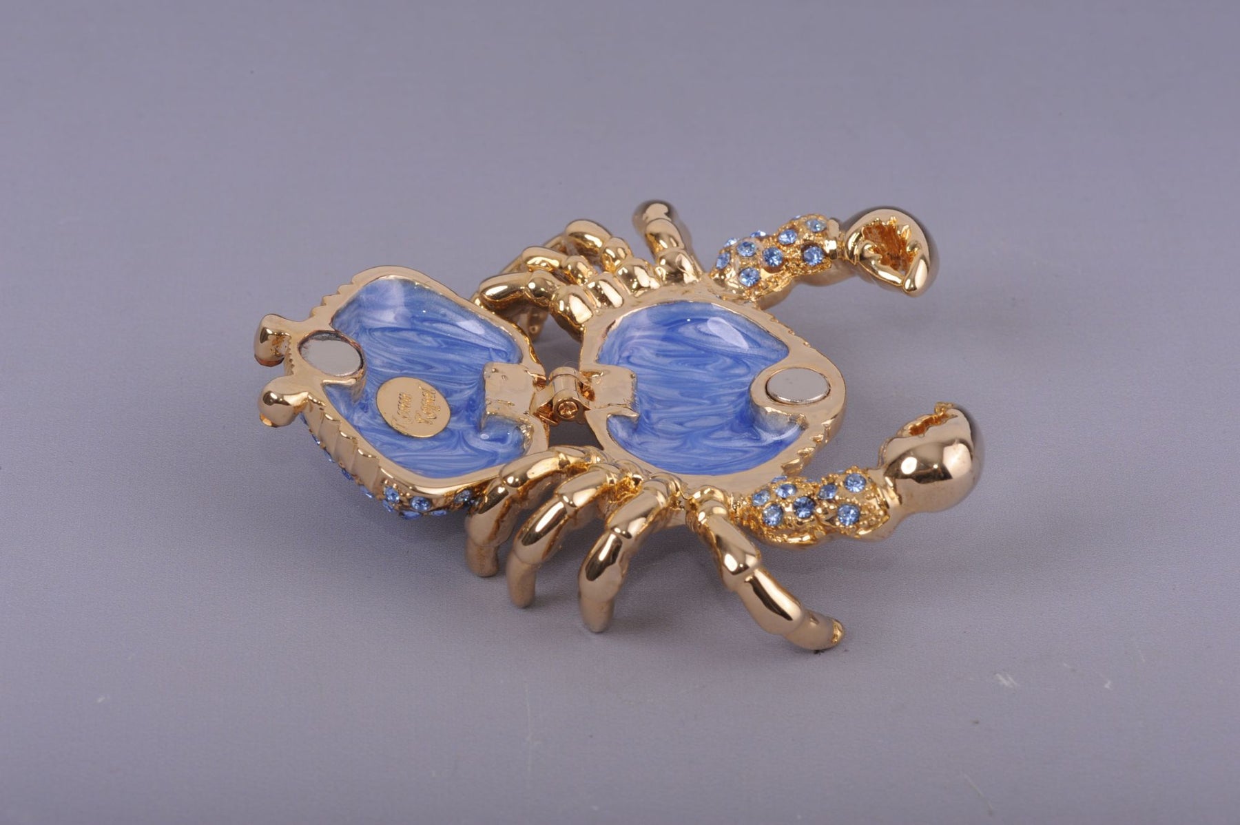 Golden Crab with blue stones