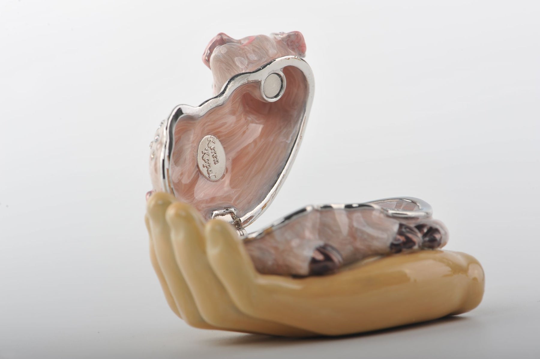 Keren Kopal Zodiac Pig Laying on Hand