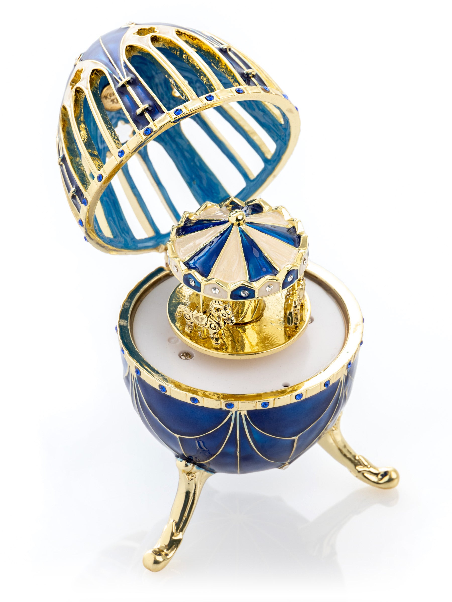 Oeuf Fabergé bleu et or avec surprise de carrousel à chevaux à l'intérieur