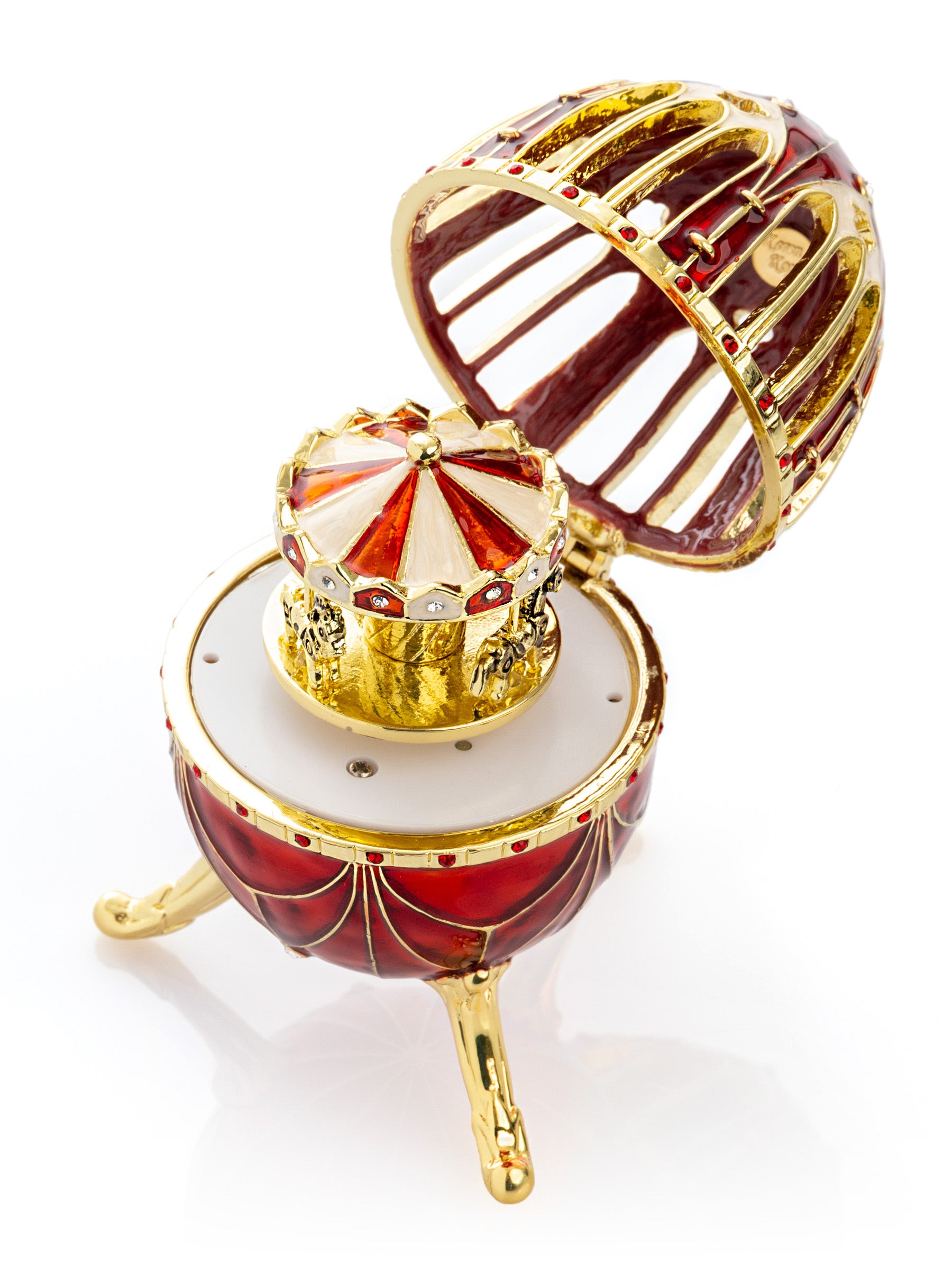 Oeuf de Fabergé rouge avec surprise de carrousel de chevaux à l'intérieur
