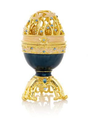 Œuf de Fabergé bleu doré avec un éléphant en or