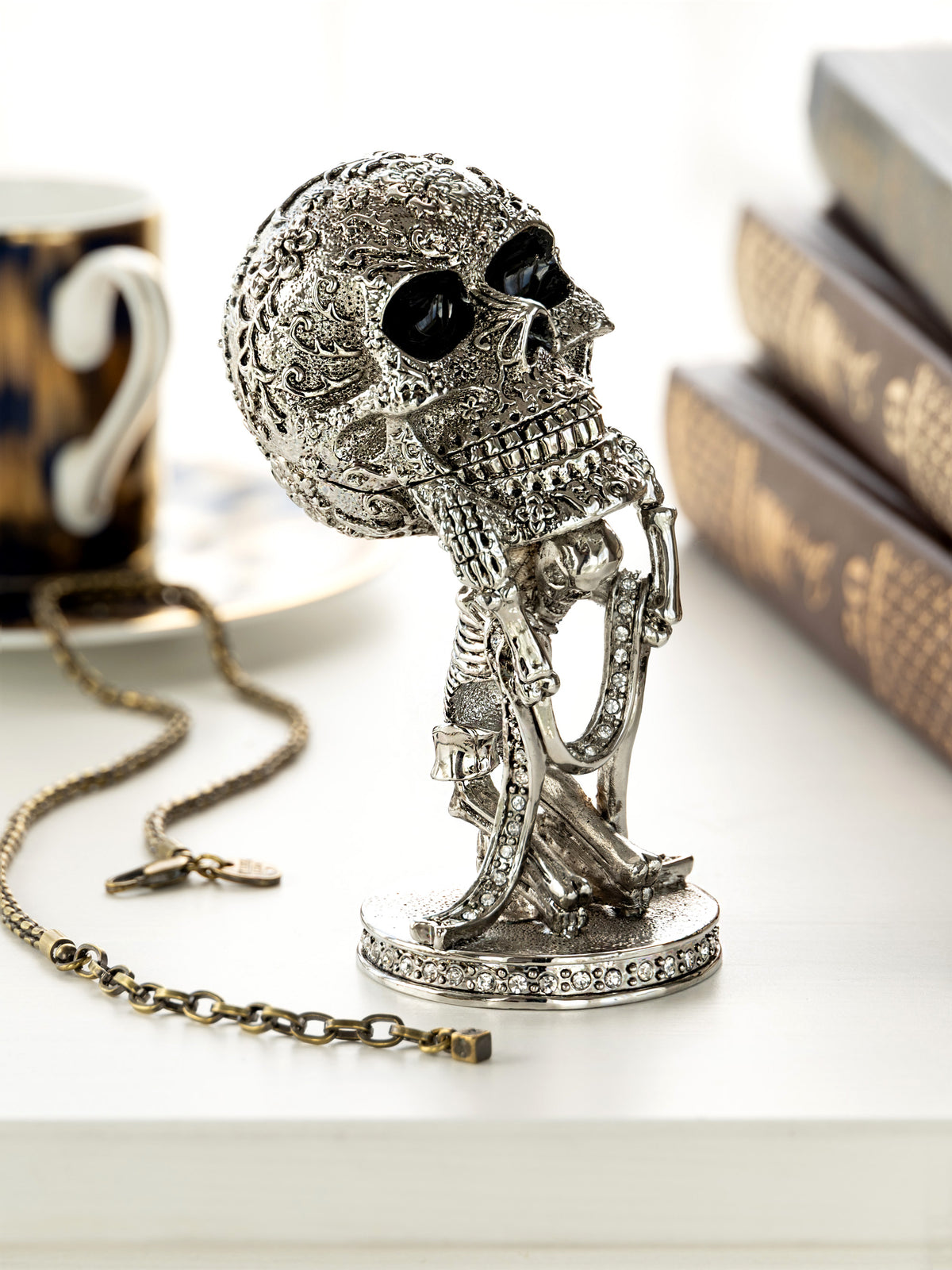 Silver Skeleton holding Skull