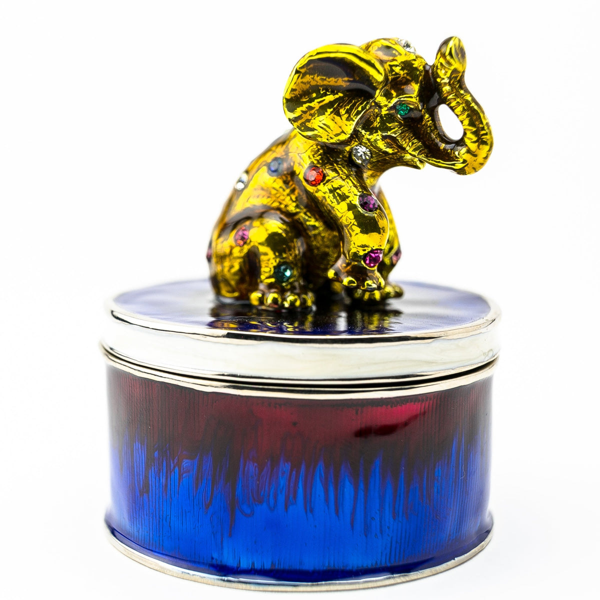 Éléphant doré sur boîte à bijoux bleue