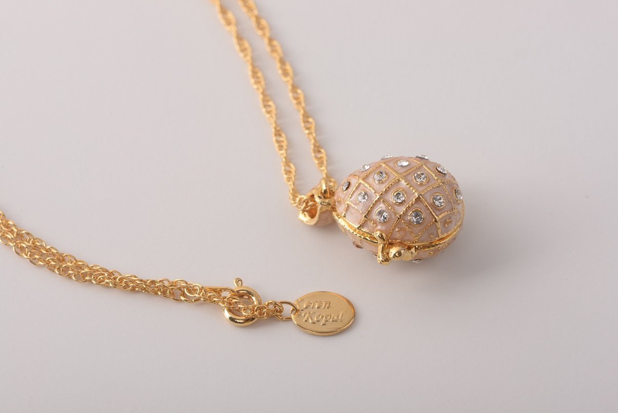 Keren Kopal Pink Pendant Necklace with an Apple Inside  37.00